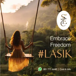 A woman on a swing overlooking a lush natural forest, symbolising the freedom you can embrace after LASIK.