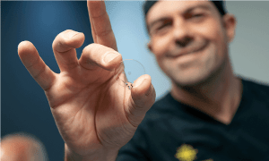 Precision at its finest – Dr Lourens Coetzee holds the delicate Allotex inlay, just 20 microns thick, as the future of near vision correction comes into focus.